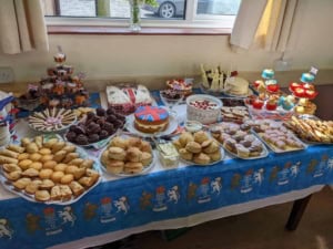 Colourful British-themed cake and snack display at Baumber Village Hall, perfect for community celebrations and events.